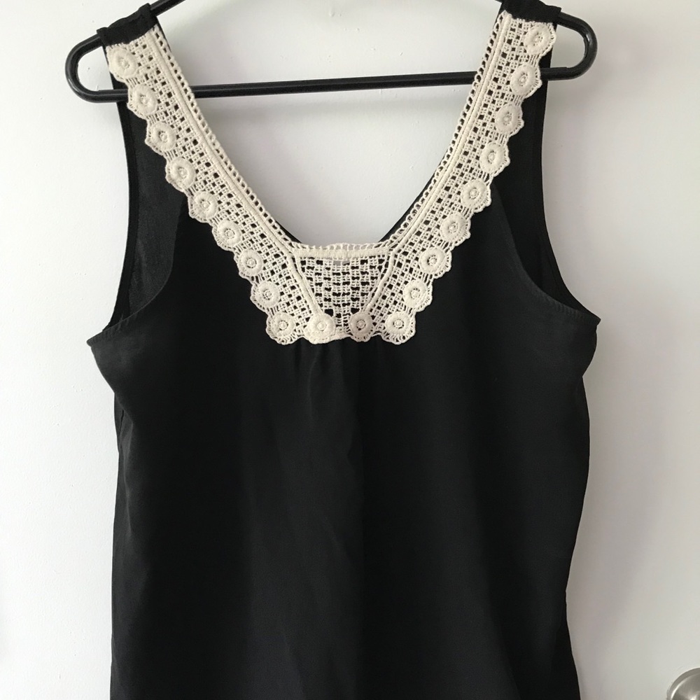 Black blouse with white crochet around neckline
